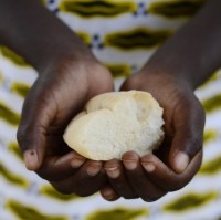 person-holding-bread-representing-malnutrition-and-famine.jpg