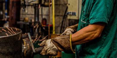 skilled welder working in industrial workshop